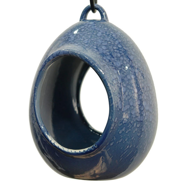 Egg Fly Through Feeder: blue ceramic feeder with open design, built-in hanging loop, deep interior, and drainage holes for easy cleaning and filling.