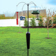 Squirrel Stopper Sequoia bird feeder station with four hangers on a sturdy black pole, featuring a squirrel-proof baffle, set in a grassy yard.