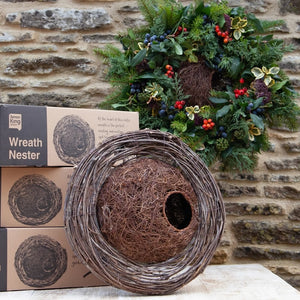 Wreath Bird House Nester: A hand-woven wreath-style nest made of twigs, designed for birds to nest, enhancing outdoor decor with eco-friendly, weather-resistant materials.