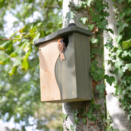 Curve Cavity Bird Nest Box on a tree, featuring a natural hollow-like entrance, designed for bird nesting, with an easy-open side panel and eco-friendly materials.