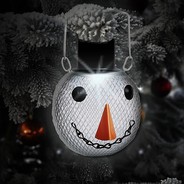 Solar Snowman Feeder: A snowman-shaped ornament with a top hat, doubling as a bird feeder with a solar light at the top, hanging from a tree.