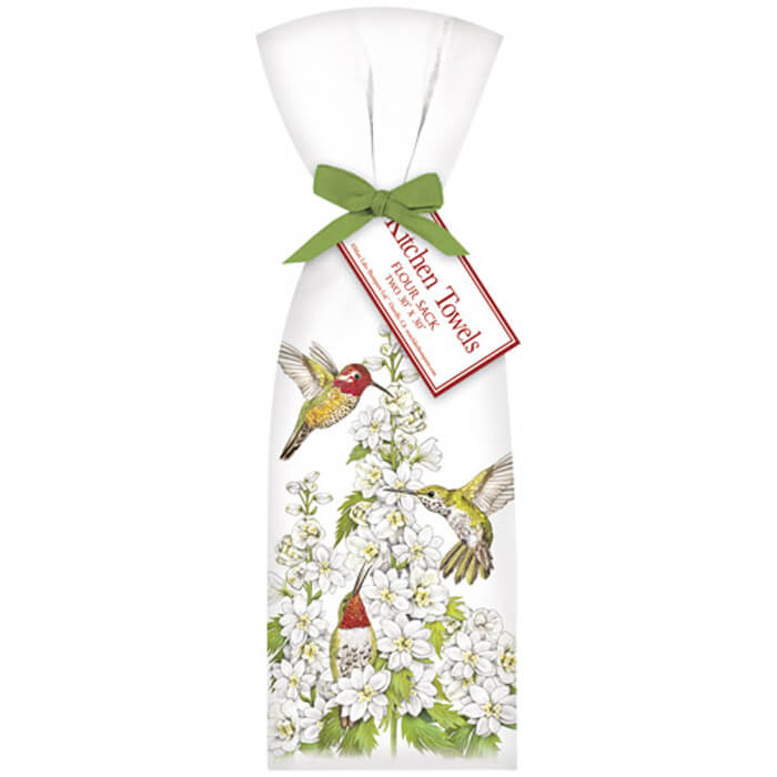 Hummingbird Flower Towel Set featuring two white cotton towels with green ribbon, adorned with a hummingbird and flower design, 30x30, packaged in the USA.