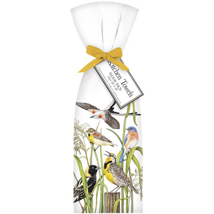 Birds in Grass Towel Set: Two white cotton towels with colorful bird designs, tied with a yellow ribbon and a bird-themed label.