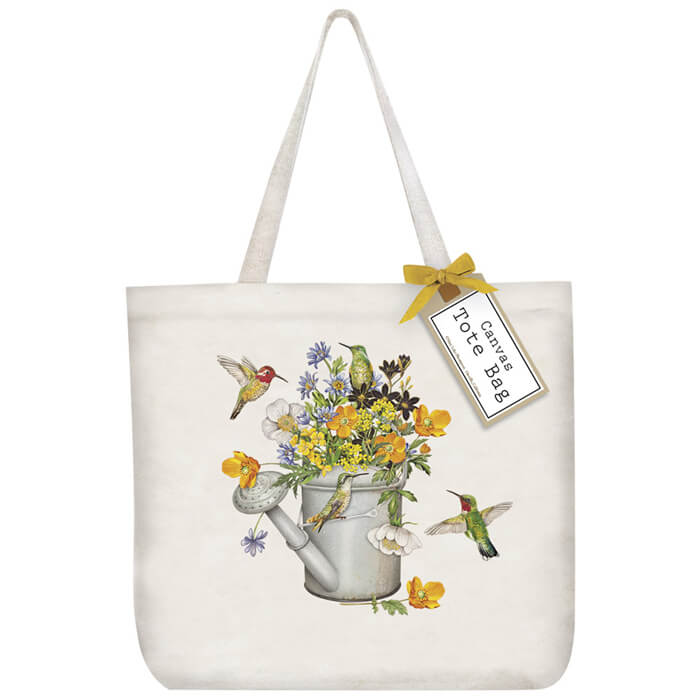 Hummingbird Water Can Tote Bag featuring colorful flowers, hummingbirds, and a watering can graphic, designed for carrying essentials. 100% cotton, 19x15.5x5.