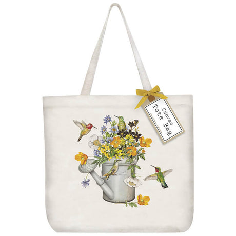 Hummingbird Water Can Tote Bag featuring colorful flowers, hummingbirds, and a watering can graphic, designed for carrying essentials. 100% cotton, 19x15.5x5.