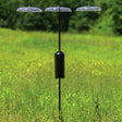 Squirrel-Proof Bird Feeding Station with three-arm pole, hanging baffles, and squirrel baffle, set in a grassy field.