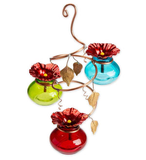 Vinester Hummingbird Feeder featuring colorful glass nectar bottles secured in a copper spiral hanger with realistic flower accents and bee guard tips.