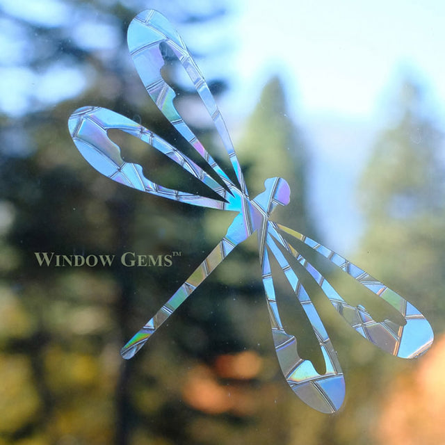 Dragonfly Window Gems, Set of 9: Assorted dragonfly decals on a window, designed to prevent bird strikes and add elegance to home or office windows.