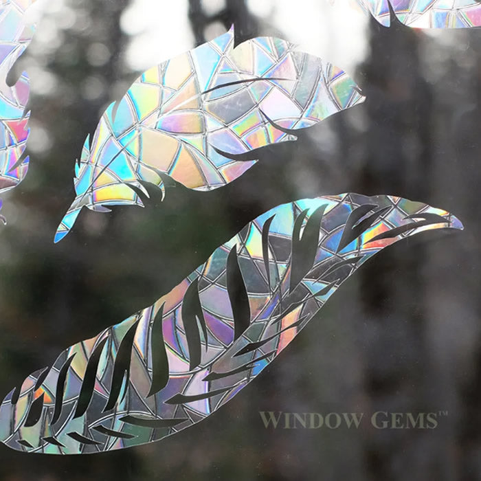 Feather Window Gems, Set of 9 decals, featuring intricate feather designs, applied to a window to prevent bird collisions while enhancing window aesthetics.