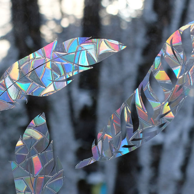 Close-up of Feather Window Gems, Set of 9, prismatic decals designed to prevent bird strikes by breaking up window reflections.