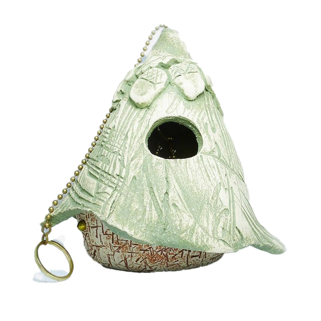 Whimsy Bird House with a key chain, featuring a hole for wrens, asymmetrical roof, and mesh flooring for ventilation. Ideal for backyard nesting.