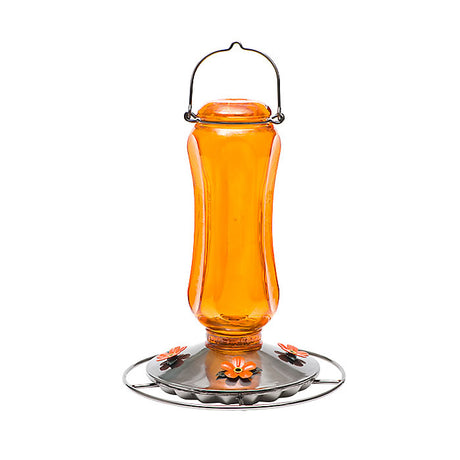 Vintage Carnival Oriole Feeder: Close-up of orange-tinted glass feeder with four flower-shaped feeding ports, wraparound perch, and metal hanger, designed for attracting orioles.