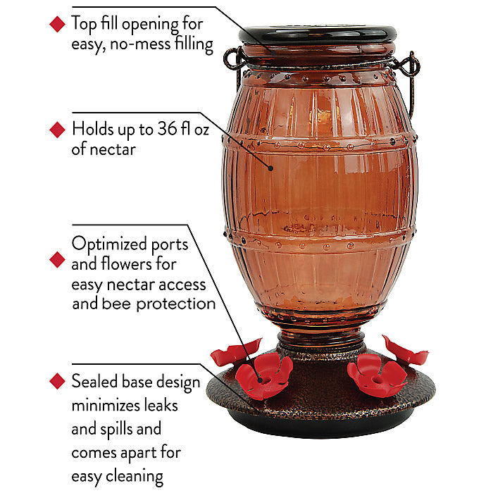 Prohibition Top-Fill Glass Hummingbird Feeder, featuring a barrel-like design with five red flower feeding ports on a two-piece speckled metal and black plastic base.