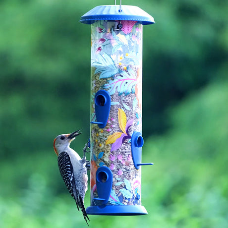 Wild Wings Fantasy Floral Easy Clean Plastic Bird Feeder with six feeding ports, featuring a bird perched on the feeder.