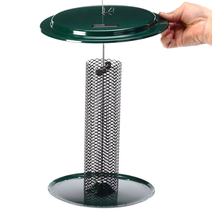 Hand holding the Birds Choice Magnet Mesh Feeder for Safflower & Hulled Sunflower, showcasing its patented mesh screen and overhanging roof design.