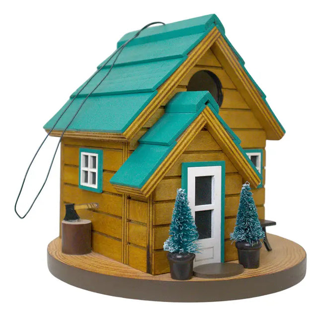 Cedar Point Cottage House, a small wooden birdhouse with trees, designed for wrens, featuring drainage, ventilation, and hanging wire for easy backyard installation.