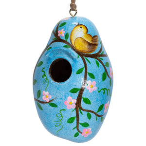 Painted Gourd Birdhouse with a bird perched on it, featuring hand-painted floral and leaf designs. Ideal for small birds, ready to hang.