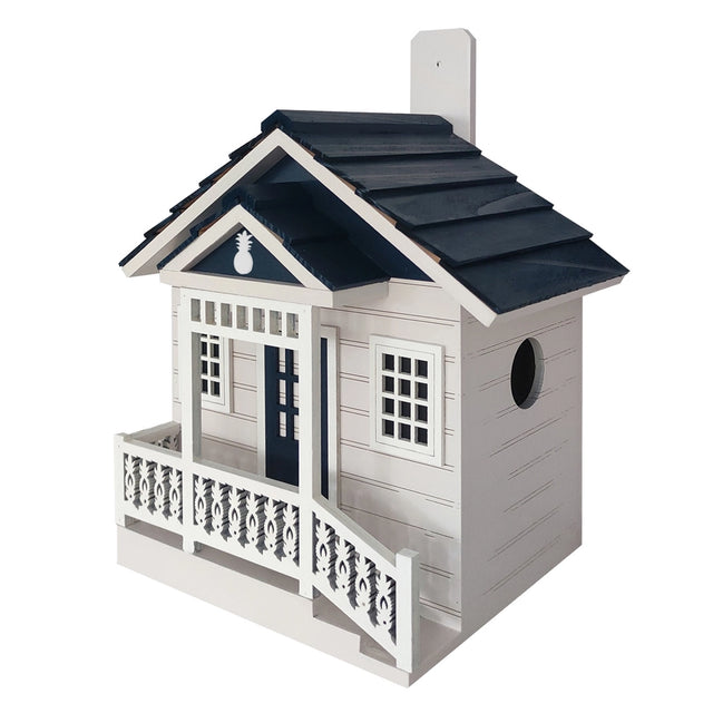 Welcome Home Cottage Birdhouse with pineapple accents, featuring a porch, ventilation, and a 1.25 entrance for small birds. Ideal for gardens.